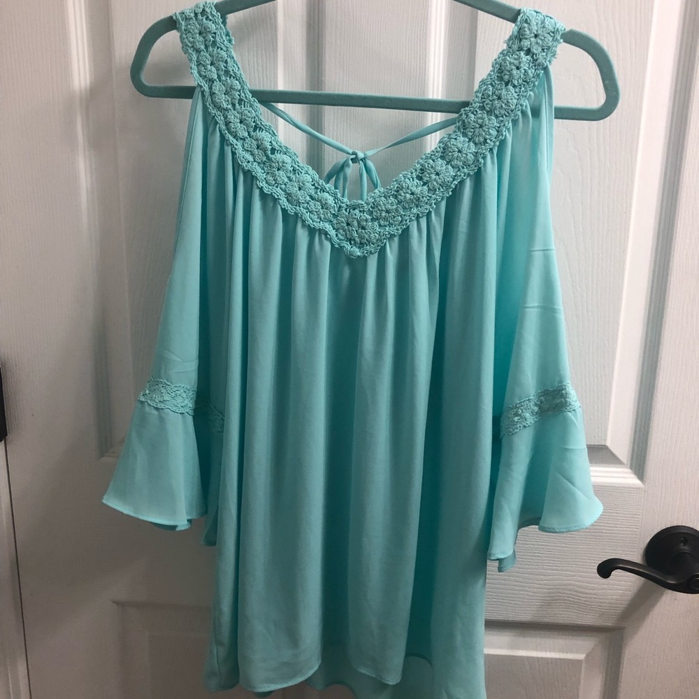 Open shoulder blouse.